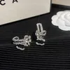 Klasyczne srebrne kolczyki na znaczku diamentowe luksusowe kolczyki popularne biżuteria w stylu mody wykwintowy prezent dla mężczyzn i kobiet luksusowe pary z pudełkiem z pudełkiem