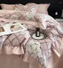 Ensembles de literie 2023 quatre pièces mode coton Double ménage drap de lit housse de couette épissage conception couleur rose clair