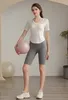 Garnière courte du yoga féminin avec poche de poitrine V - Conne T-shirt Crew Necwear Vêts de sport