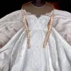 2023 Robes de mariée de luxe robe de bal bijou cou illusion dentelle appliquée manches longues overskirts cathédrale train robes de mariée sur mesure robe de mariée dos ouvert