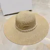 Letni kapelusz przeciwsłoneczny z szerokim rondem Luksusowy perłowy kapelusz słomkowy Kobiety Outdoor Holiday Beach Fashion Hats