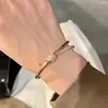 Brazalete de diseñador de moda, pulsera con nudo, accesorios de bola preciosos de lujo para mujer, regalo exquisito brillante de circón, Material de cobre para novias