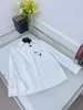 Chemisiers pour femmes Chemises de créateurs La chemise à poche minimale continue le processus sans repassage Nouveau début du printemps 2023 BYEO