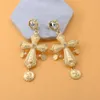 Boucles d'oreilles 2023 European et American Retro Goddess Golden Cross Spring Summer Femmes