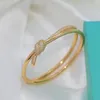 Brazalete de diseñador de moda, pulsera con nudo, accesorios de bola preciosos de lujo para mujer, regalo exquisito brillante de circón, Material de cobre para novias