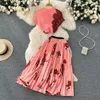 A saia impressa curta com grande swing rosa plissabilable de verão de verão elástica Cintura de duas peças Roupas 230316