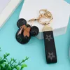 Designer porte-clés sangle de téléphone portable 2022 nouveau dessin animé mignon porte-clés en cuir sac clé pendentif voiture porte-clés décoration cadeau