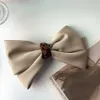 Mody dwupaliwowe Bowknot Ribbon Solidny kolor spinki do włosów Kobieta Dziewczyna Satyna Barrette Bow Back Głowa Sprężyna