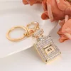 Fashion Design Key Ring Perfume Bottle Keychains Holder for Women Creative Crystal Rhinestone Diamond Metal Car Keyring Chain Bag Pendant Gift Jewelry Accessories