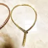 Дизайнерская коллекция Стиль званого ужина Колье с вырезом в оправе Ожерелье с бриллиантовым покрытием Золотого цвета Змееподобные широкие ожерелья5793546