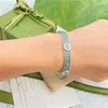 2023 Designer Nouveau bijoux argent sculpture utilisé motif goutte colle vert clair émail bracelet pour hommes et femmes