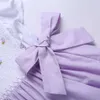 女の子のドレスがスモックした夏の紫の赤ちゃんの誕生日パーティープリンセス結婚式