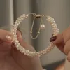 Länkarmbandkedja sötvatten pärla till hands mode enkel magnet spänne temperament och personlighet för kvinnor