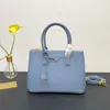Designer Brand Solid Color dubbelhandtag läder handväska kvinnors nya shopping mode multifunktionell stor kapacitet tvärkropp enkel axelväska