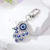 Evil Eye Hamsa Hand Keychain Portachiavi per donna Uomo Hollow Fatima Hand Blue Eye Bag Accessori chiave per auto