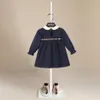 Robes de fille filles robe d'automne couleur solide cou rond volant à manches longues rayées à manches longues en coton robe A-line avec boutons arrière pour enfants 2 à 7 ans 230320