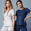 Pantaloni da donna in due pezzi Set da scrub da donna personalizzato all'ingrosso Top con cerniera in metallo e pantaloni Uniforme da infermiera 230320