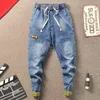 Männer Hosen Mode Trendy Männlich Koreanische Kleine Füße Denim Jeans Kordelzug Sozialen Geist Guy Cowboys Teenager Harem 230317