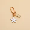 Daisy Keychain Niche Flower Airpods Bluetooth hörlurar täckt tillbehör hänge för flicka och kvinna kreativ gåva