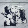 23SS Summer Designer Men TrackSuits Mens Zestaw Hawaje Klasyczny kombinezony Womens Tshirts Luksusowe swobodne bryczesy Szorty graffiti i setki koszuli