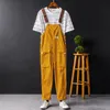 Mäns byxor sommar män smällar fast färg casual jumpsuit streetwear joggers multi fickor mode hängslen last overall 230317