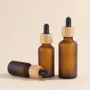Frosted Brown Glass Cosmetic Packaging Bottles with Dropper and Bamboo Lids