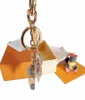 high qualtiy brand Designer Aolly Keychain Fashion Pendant Car Chain Charm Brown Flower Mini Bag KeyringTrinket Gifts Accessories 5052899