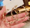 Klassisk lyx ny populära örhängen klassisk stil cirkulär vågstil studörhängen vackra örhängen kvinnor bröllop smycken örhängen hög kvalitet gåva