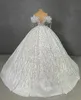 Robes de mariée de bal de bal de luxe Sans manches V cou de cou sur les paillettes d'épaule Appliques Ruffles Perles Robes de mariée Robe formelle plus taille