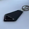 Designer key chain wallet bag tie keying with creative spring buckle decorate portachiavi daily car key pendant triangle keychains designer mens PJ056 B23