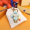 سلسلة مفاتيح عالية الجودة الكلاسيكية المصممة الفاخرة Sunflower key chain men car keyring women buckle buckains keychains hags hights with box and dustcbag j99