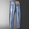 2023 lente/zomer dunne lichtblauwe jeans heren achterzak laserpatroon elastische slanke fit kleine voeten modebroek mannen