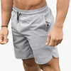 Herr shorts män gym fitness löst shorts kroppsbyggande joggar sommar quickdrry cool korta byxor manlig casual strandmärke Sweatpants 230323