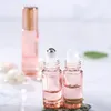 Bottiglia di profumo 12 pz / lotto 5 ml / 10 ml Rotolo in oro rosa su bottiglia Vetro spesso Fiale di olio essenziale di profumo vuoto con sfera in acciaio inossidabile 230323