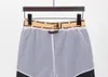 Homens designer feminino shorts shorts de algodão calça xadrez estampado de cordão