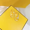 Designer Donna Uomo Orecchini Cerchi Orecchini dorati di moda di lusso intarsiati con lettere di strass Orecchini a bottone simmetrici Regalo per il giorno delle nozze