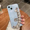 Fashion Women Phone Cases voor iPhone 14 Plus 13 Promax 12 Pro 11 XS XR XSMax lederen telefoonhoes Pearl Bracelet iPhone Case