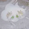 Encanto JUWANG Eleagant Exquisito Flor Mariposa Mujeres Pendientes Bling Shining AAA Zircon CZ Stud Pendiente Boda Joyería Colgante Z0323