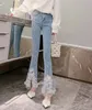 Kvinnors jeans koreansk stil söt tung industrin pärlor blommor slits hem slim denim flare pant kawaii lolita våren hög midja 230324