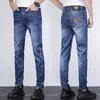 Jeans masculino Spring e Summer Color Fin Color Head VJ Half Face algodão elástico azul lamin