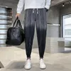 Jeans da uomo 2023 pantaloni moda da uomo primaverili e autunnali patchwork coreano stampa coulisse elastico casual