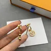 Kvinnor Fashion Gold Earrings Luxury Designer Stud för kvinnor Asymmetrisk enkelhet 2023 Brev Växt Tillbehör Ear Studs Smycken