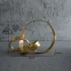 Dekorativa föremål Figurer Simple Metal Gold Hollow Out Twist Art Ornament Oregelbundet vardagsrum Ornament Desk Decoration Nordic Home Decor Accessories 230324