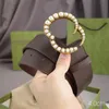 Moda Donna Uomo Cintura Designer Marchio Oro intarsiato Cintura con perle Fibbia in rame Pelle bovina Doppia lettera Cinture Larghezza 4 cm Vari colori