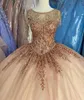 Champagne Quinceanera Dresses With Gold Sequins Applique Scoop Neck Tassle Beaded Floor Length Tulle Corset Back Sweet Party Prom Ball Evening Vestidos