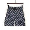 2021 Nouveaux hommes Femmes Designers Pantalons courts Vêtements Lettre Impression Bande Sangle Cinq points Casual Beach Shorts Vêtements