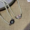 Lisas samma Vivian Ansey Empress Dowager Emalj Saturn Pearl Necklace Small Light ClaVicle Chain Planet örhängen Tide
