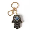 Klaki Bling Eye Eye Hamsa Ręka Blak Klapeta Bag worka Klucz Pierścienie Mężczyzn Crikon Akcesoria samochodowe Metalowe klamry