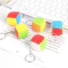 ミニキューブキーチェーンマジックキューブ3段ルービックキューブキューブキーチェーンパズルモーファンジは、子供向けのプロのキューボマジックトイー