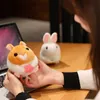 A cute hamster with a wagging tail, a stuffed toy doll, a rabbit, a string doll, a New Year's birthday gift